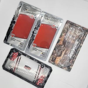 4 pieces of  different numbers number plate. There is camo and two eagle plates